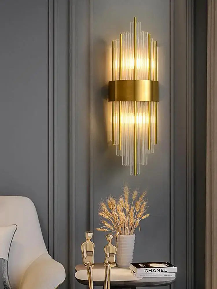 Gold-toned decorbites art deco wall sconce with vertical ribbed glass rods and central stainless metallic band for bedroom decor