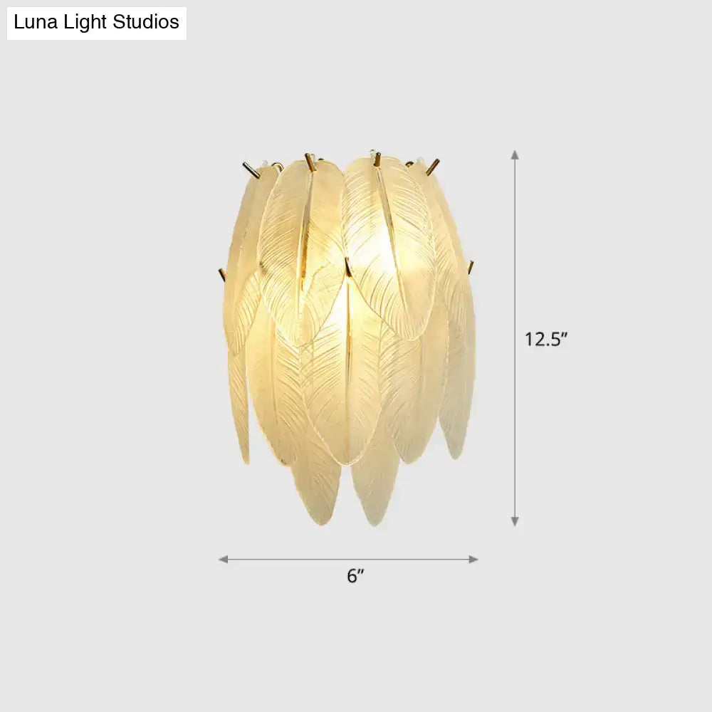 Art deco leaf sconce lamp with clear glass, brass leaf design, and golden frame for elegant dining room lighting