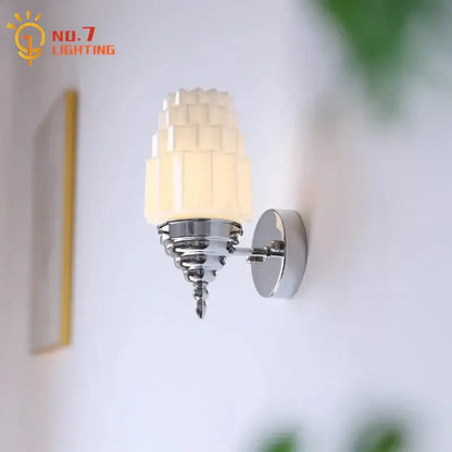 Art deco chrome wall lamp with decorbites cream glass led tiered shade and polished metal base for bedroom lighting