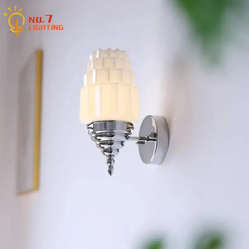 Art deco chrome wall lamp with decorbites cream glass led tiered shade and polished metal base for bedroom lighting