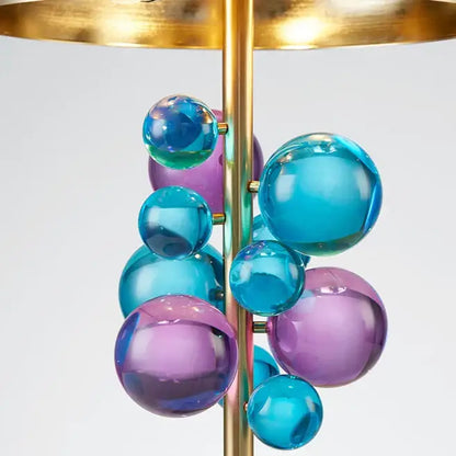 Art deco gold and crystal bubble led desk lamp with brass rod and translucent blue purple glass spheres on marble base