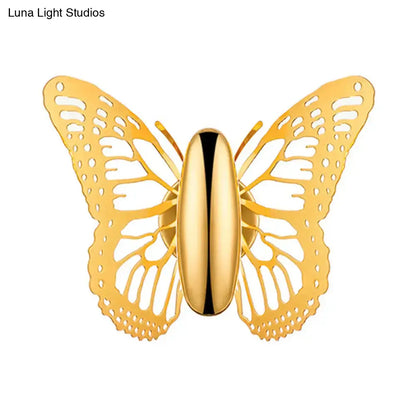 Gold butterfly wall sconce with intricate cut-out wings and polished metal finish for kids room decor