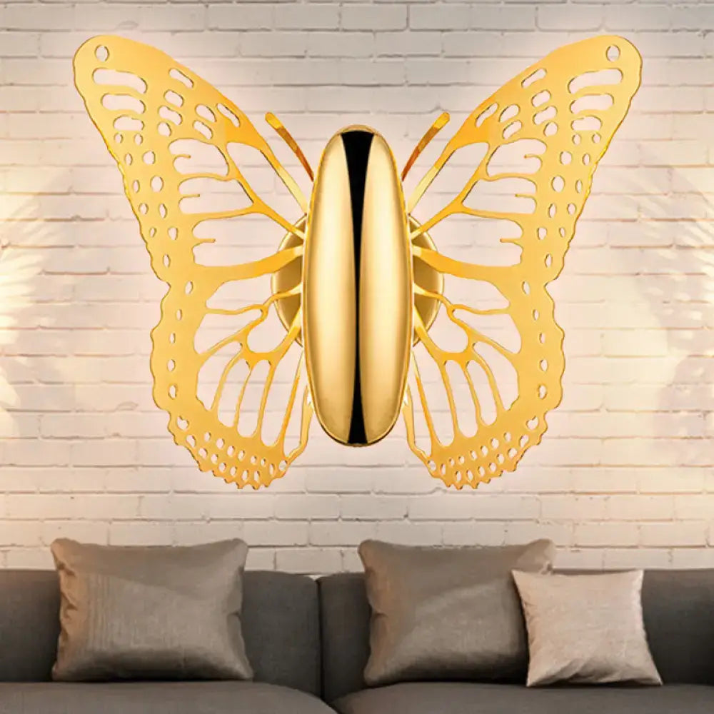Gold butterfly wall sconce metal lamp with intricate cutout wings and sleek body for kids room decor