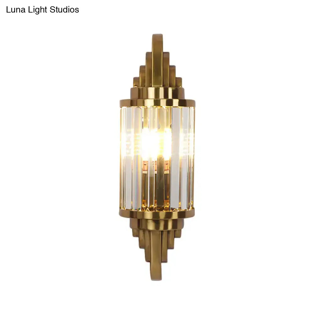 Art deco wall light with gold finish metal frame and crystal prisms for living room use