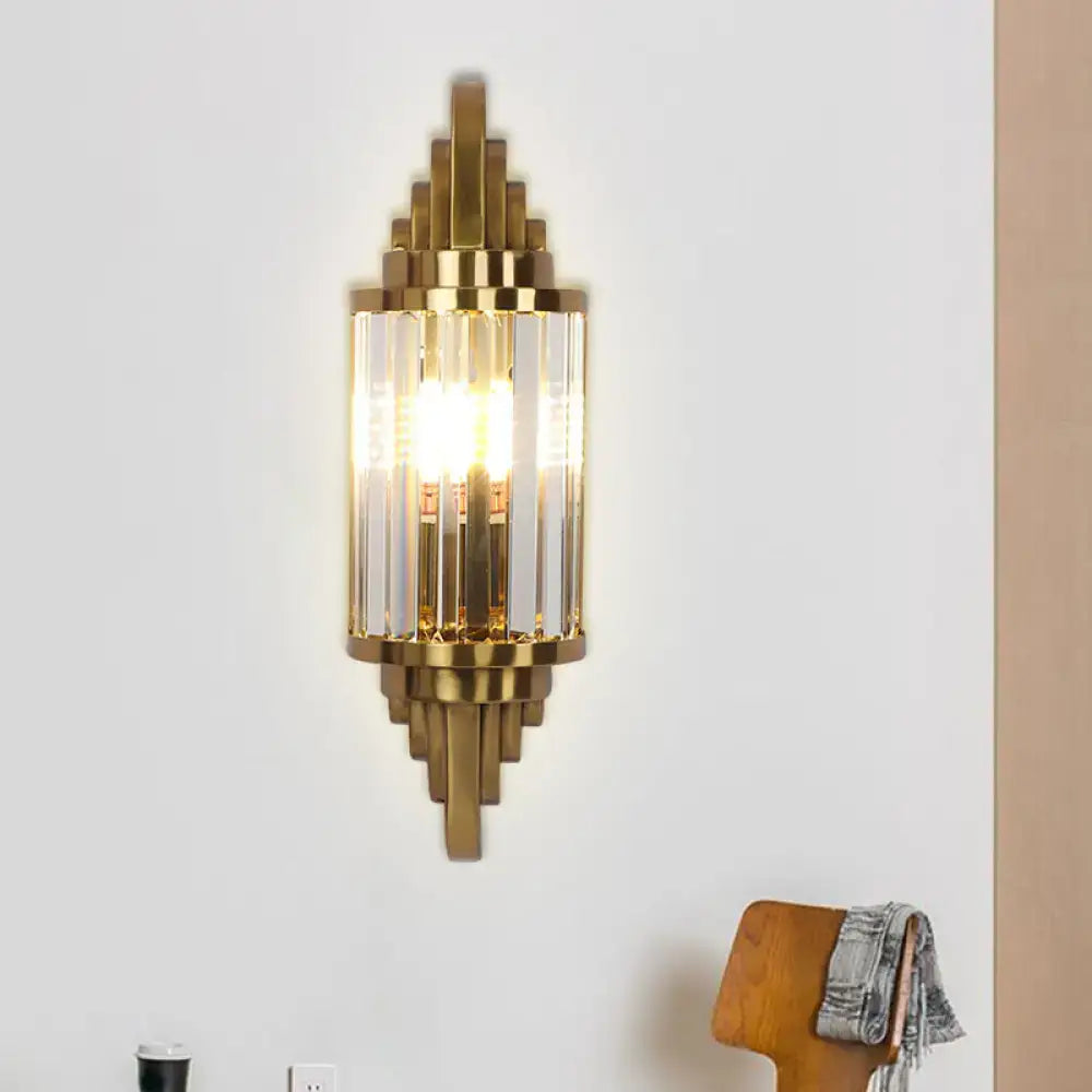 Art deco gold finish wall light with crystal prisms and geometric metal framing for living room lighting