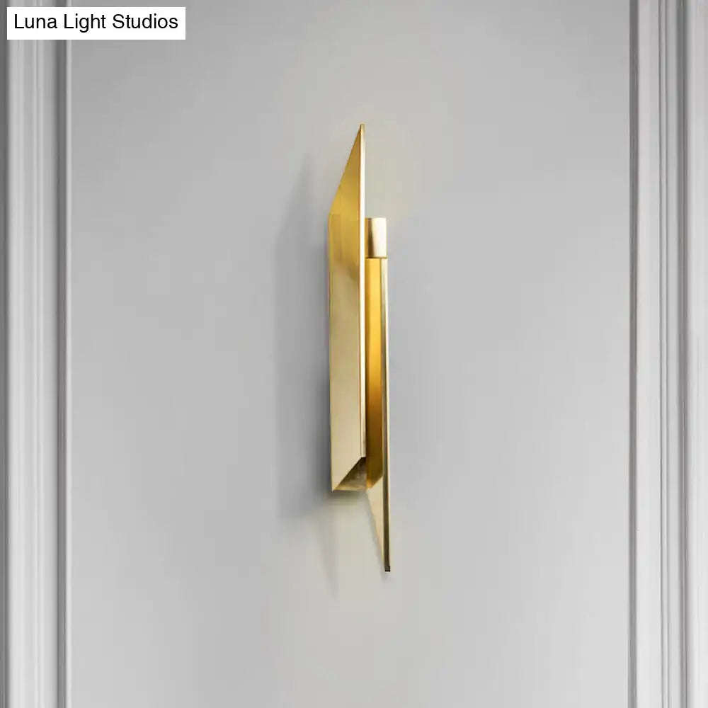 Art deco gold geometric wall lamp with metallic finish and sleek angular design for modern bedroom lighting