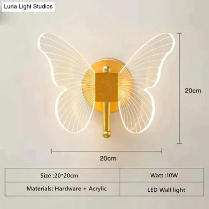 Art deco gold butterfly wall lamp with translucent acrylic wings and metallic base for bedroom bedside wall use