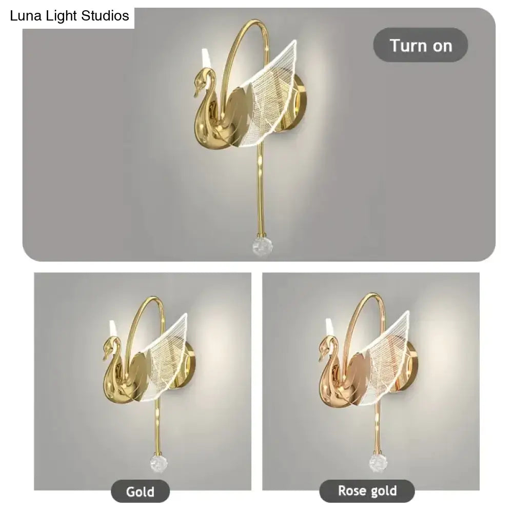 Art deco gold-toned swan wall lamp with mesh wings and crystal accent for elegant bedroom bedside wall lighting