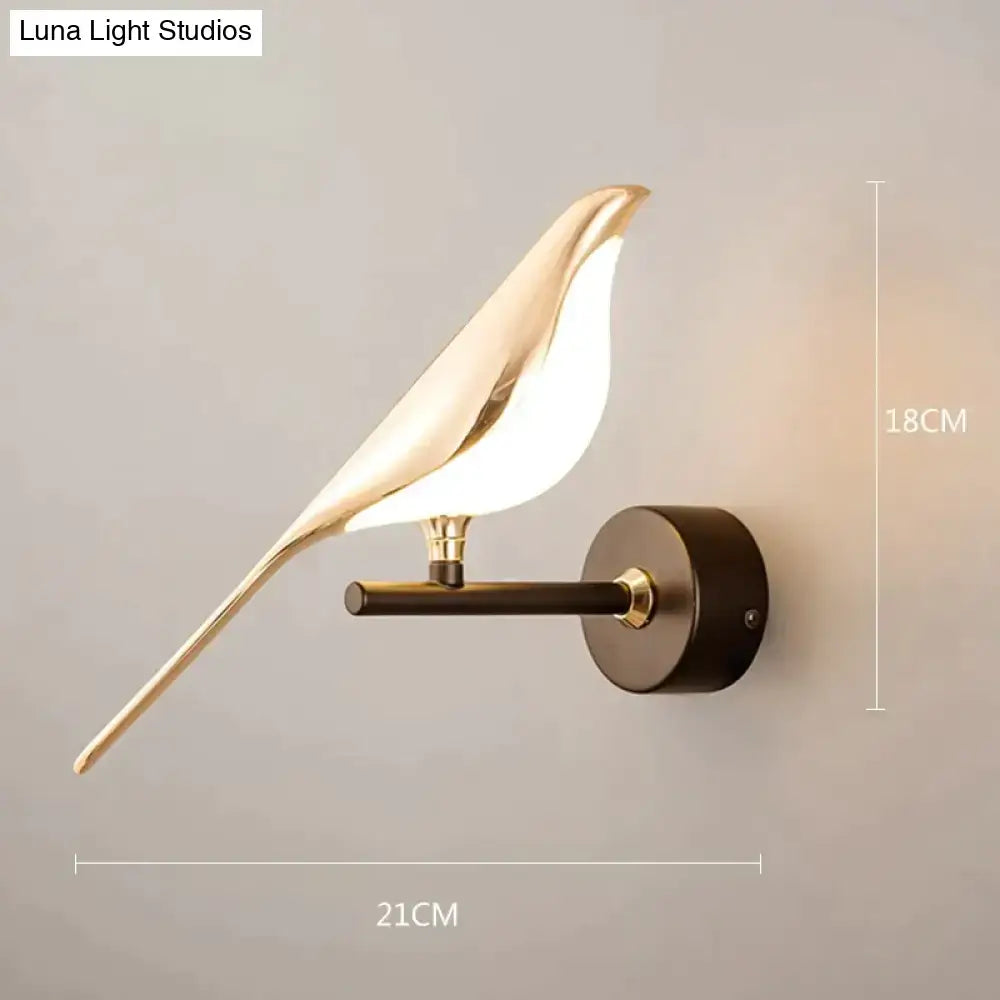 Gold-toned art deco swan wall lamp with crystal and matte black base for elegant bedroom bedside wall lighting