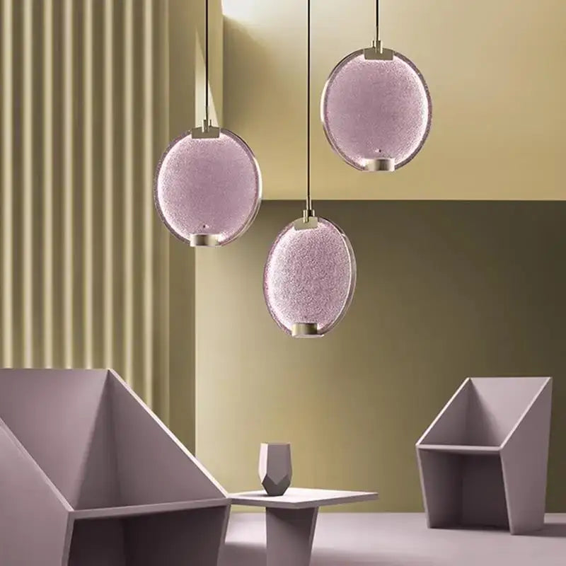 Three lavender glass horo led pendant lights with textured surface and metallic fixtures for kitchen decorbites pendant light