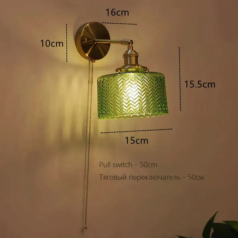 Art deco led wall lamp with green textured glass chevron shade and brass finished decorbites art deco sconce for bedroom