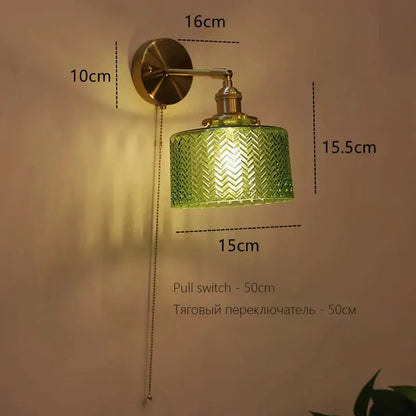 Art deco led wall lamp with green textured glass chevron shade and brass finished decorbites art deco sconce for bedroom