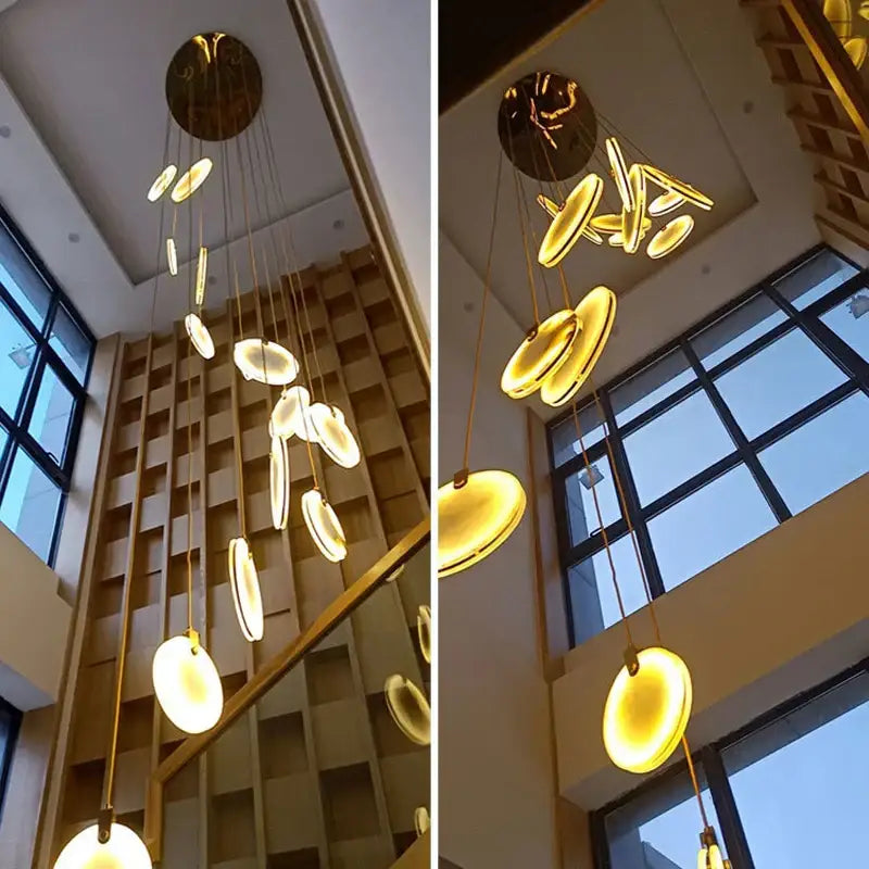 Golden circular art deco marble pendant light with illuminated discs and polished brass fixture for dining room use