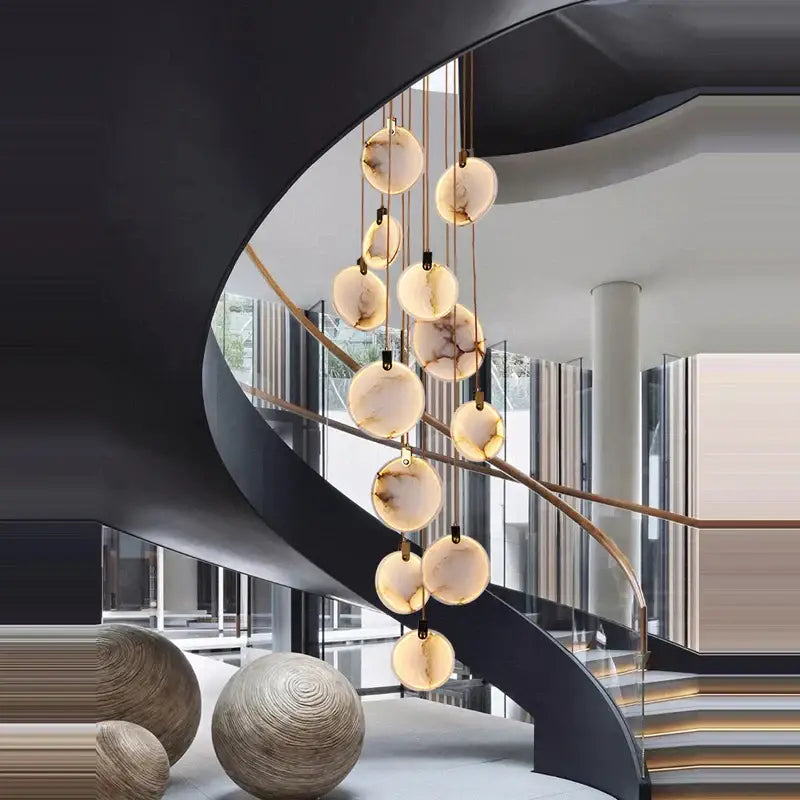 Art deco marble golden lustre pendant light with amber translucent glass orbs for dining room illumination