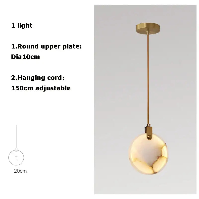 Art deco marble golden lustre pendant light with a spherical white onyx globe and adjustable brass cord for dining room