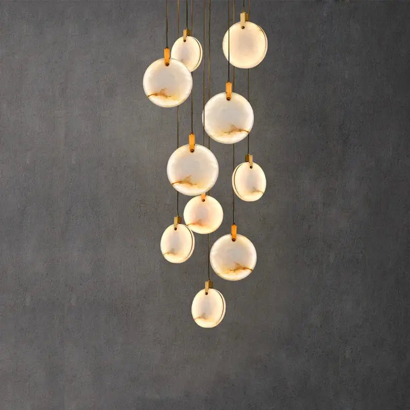 Art deco marble golden lustre pendant light with translucent white opal discs and gold-toned hardware for dining room