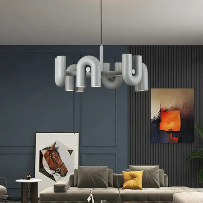 Modern silver pipe art deco metal chandelier with curved interconnected arms for black and orange dining room decorbites art deco