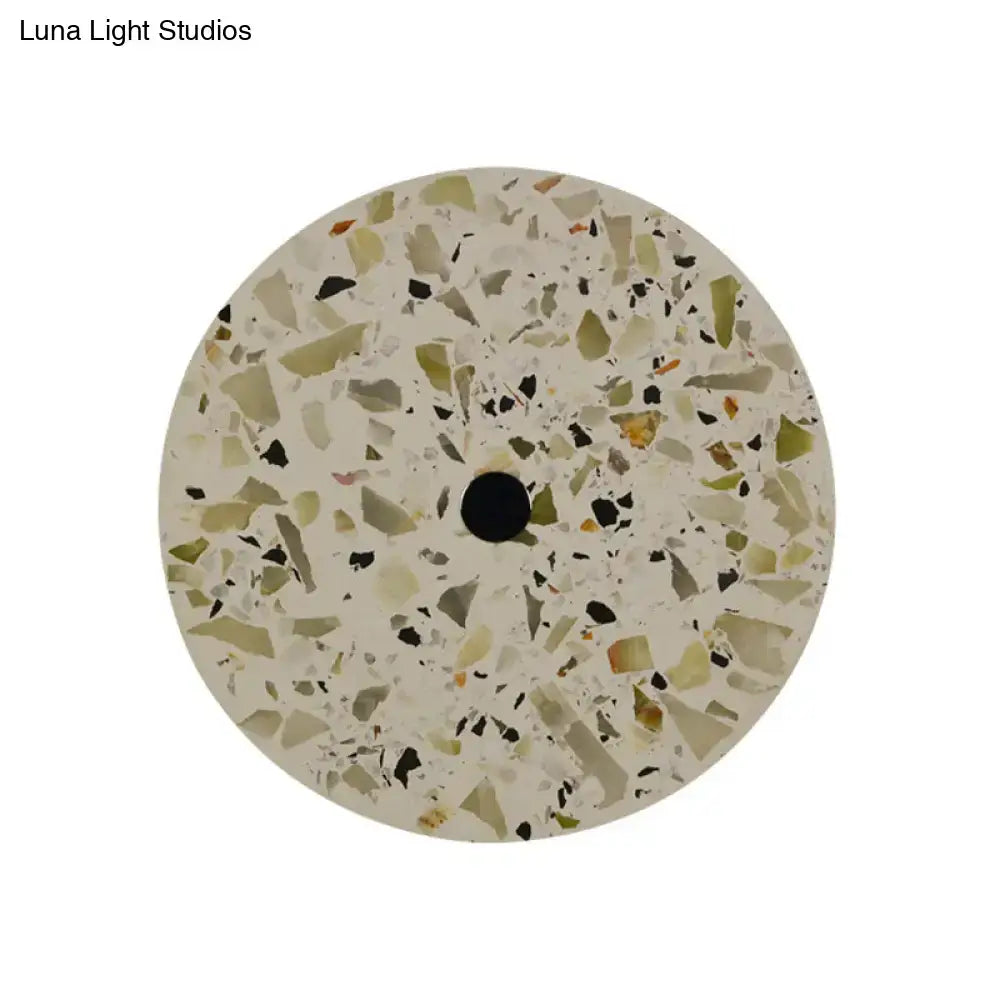 Art deco mosaic terrazzo led wall sconce with green beige and black fragments on creamy base for living room use