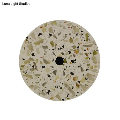 Art deco mosaic terrazzo led wall sconce with green beige and black fragments on creamy base for living room use