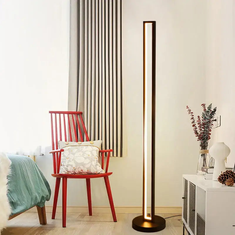 Modern minimalist floor lamp with sleek dark metallic finish and vertical light strip for art deco decorbites ambient lighting