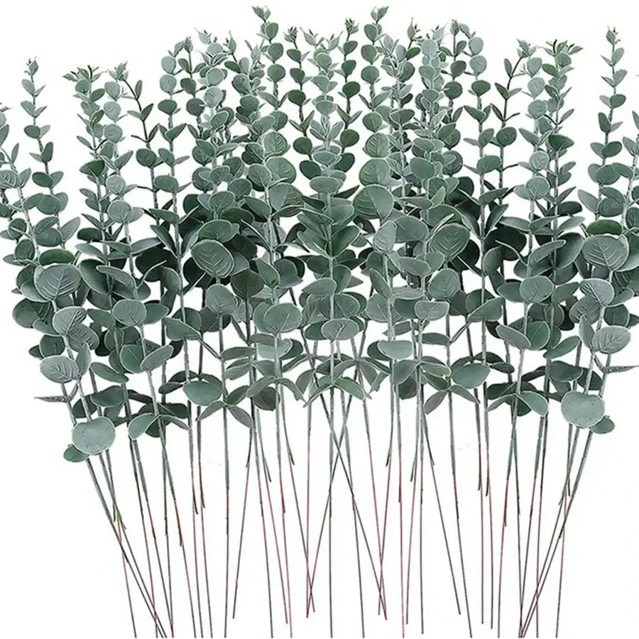 A bundle of artificial eucalyptus greenery stems with round matte green leaves and slender brown sticks for decor