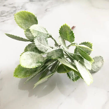 Frosted green artificial foliage with delicate leaf shapes in a decorbites green plant flower cherry berries bundle for living room decor