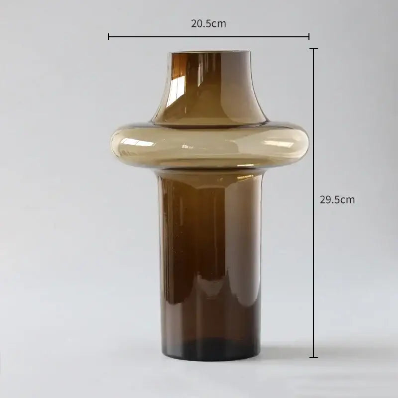 Artisan glass vase with a sleek amber-tinted glass and modern sculptural design for elegant decor