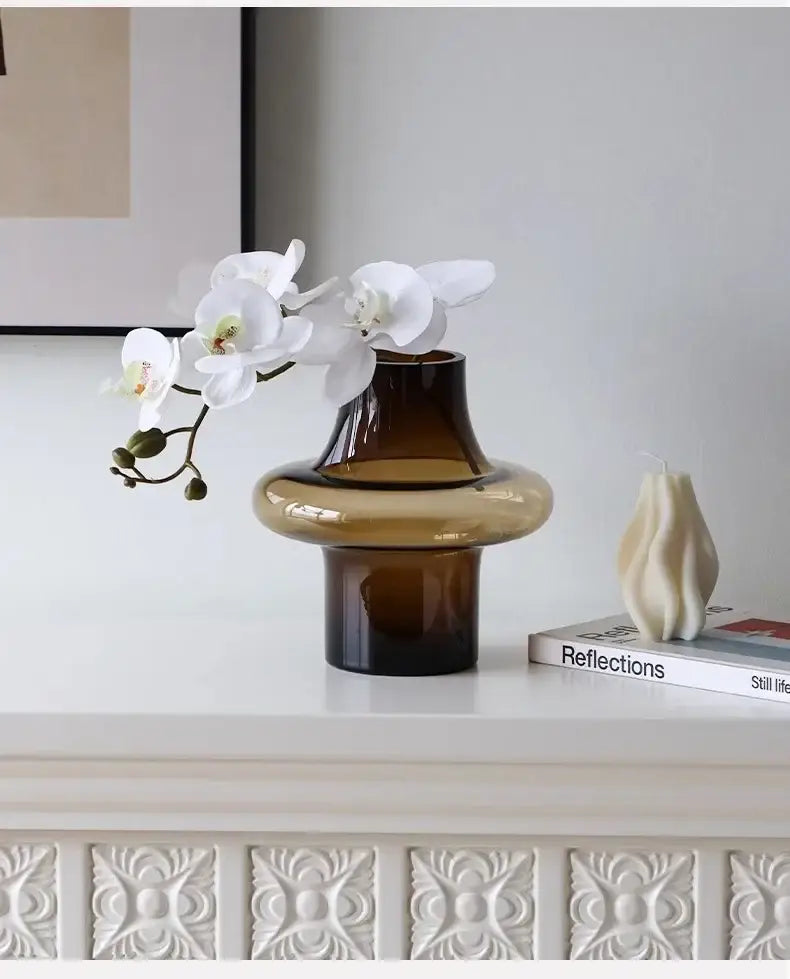 Artisan glass vase with sleek two-toned amber glass and modern tiered design for elegant decor and art glass collection