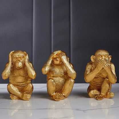 Artisanal three wise golden monkey sculpture in resin featuring see hear and speak no evil poses for living room decorbites decor