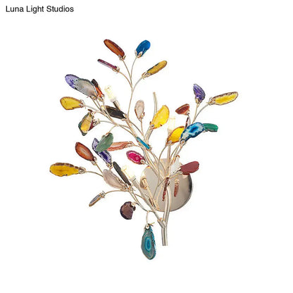Artistic agate leaf wall light with vibrant multi-colored gemstone slice and metallic frame for living area bulb base