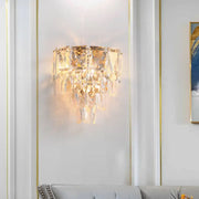 Artistic gold crystal tiered wall lamp with cascading teardrop crystals for elegant living room wall light decor