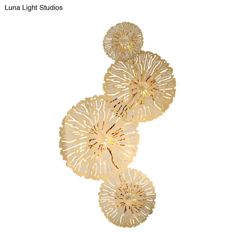 Artistic golden lotus leaf sconce light fixture with gold-toned intricate radial coral pattern wall art