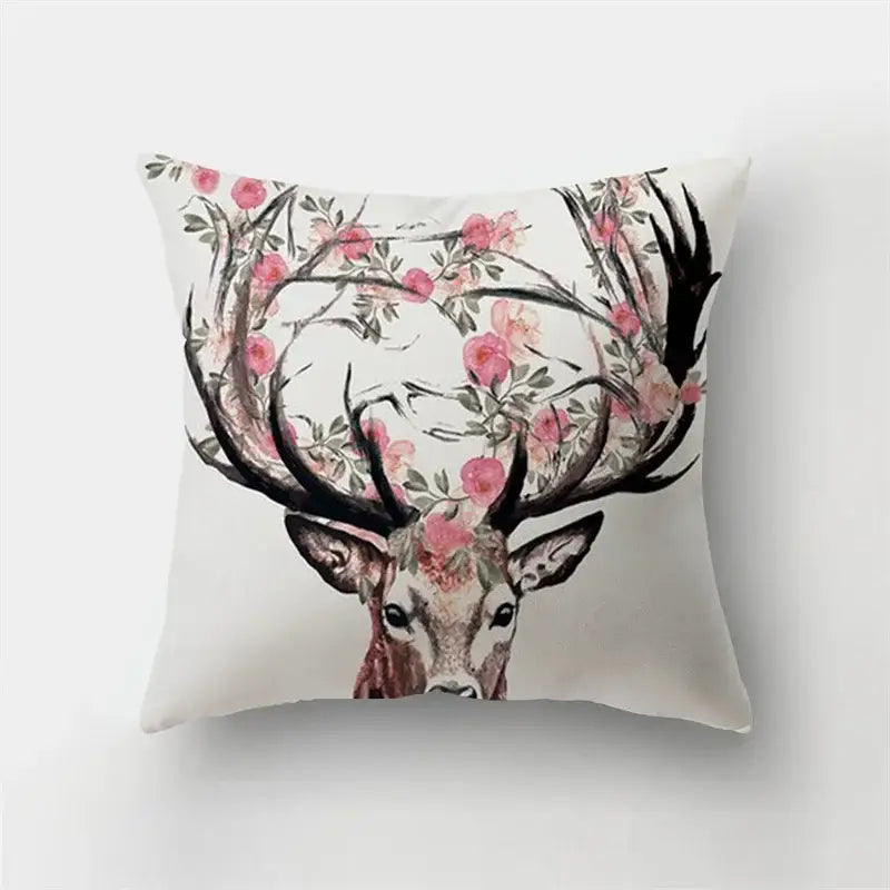 White short plush throw pillow with decorbites deer animal featuring black antlers and pink flowers for bedroom decor