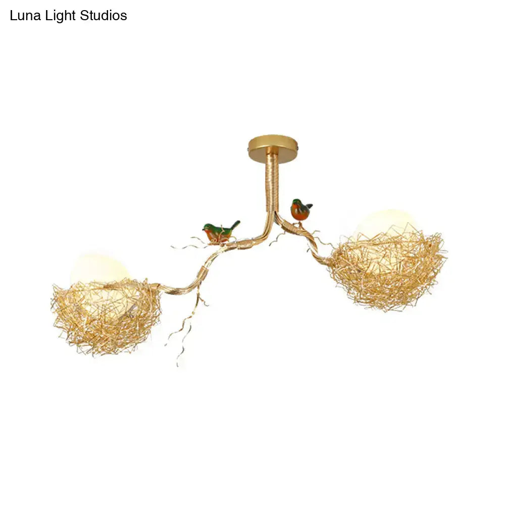 Gold-toned chandelier pendant with artistry milk white glass balls and hand sewn aluminum bird nests on branching arms