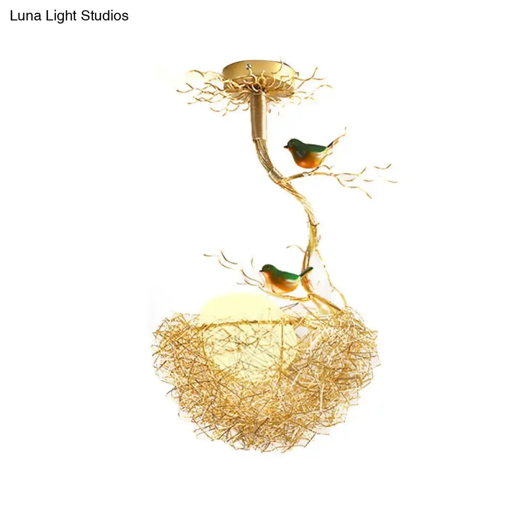 Golden chandelier pendant with artistry milk white glass balls and intricate bird-inspired aluminum branch design