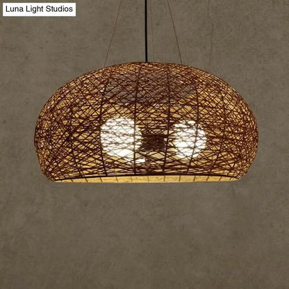 Warm-toned asian rattan dome pendant light with natural brown finish and intricate crisscross pattern e26 e27 bulb base