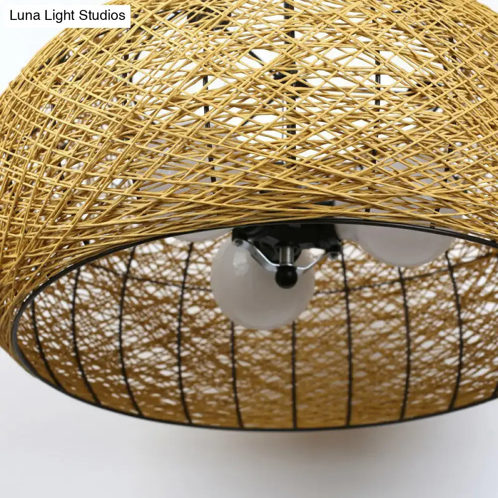 Asian rattan dome pendant light with woven golden-brown rattan shade black metal frame and three frosted e26 e27 bulb base bulbs