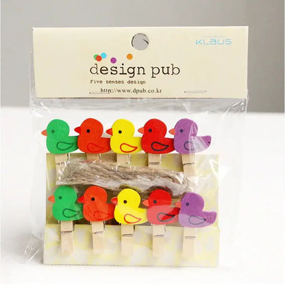 Assorted colorful wooden clips shaped like birds in green red yellow and purple mini wooden clips for photo decor