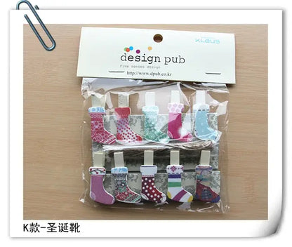 A set of assorted colorful heart mini wooden clips in christmas stocking shapes with design pub packaging for photo decor