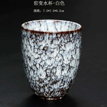 A white crackle glaze ceramic kung fu tea cup with brown speckles and textured surface from decorbites tea cups set