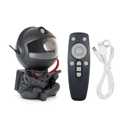 Black astronaut-themed galaxy star night light projector with red accents, remote control, and usb cable for decorbites galaxy star