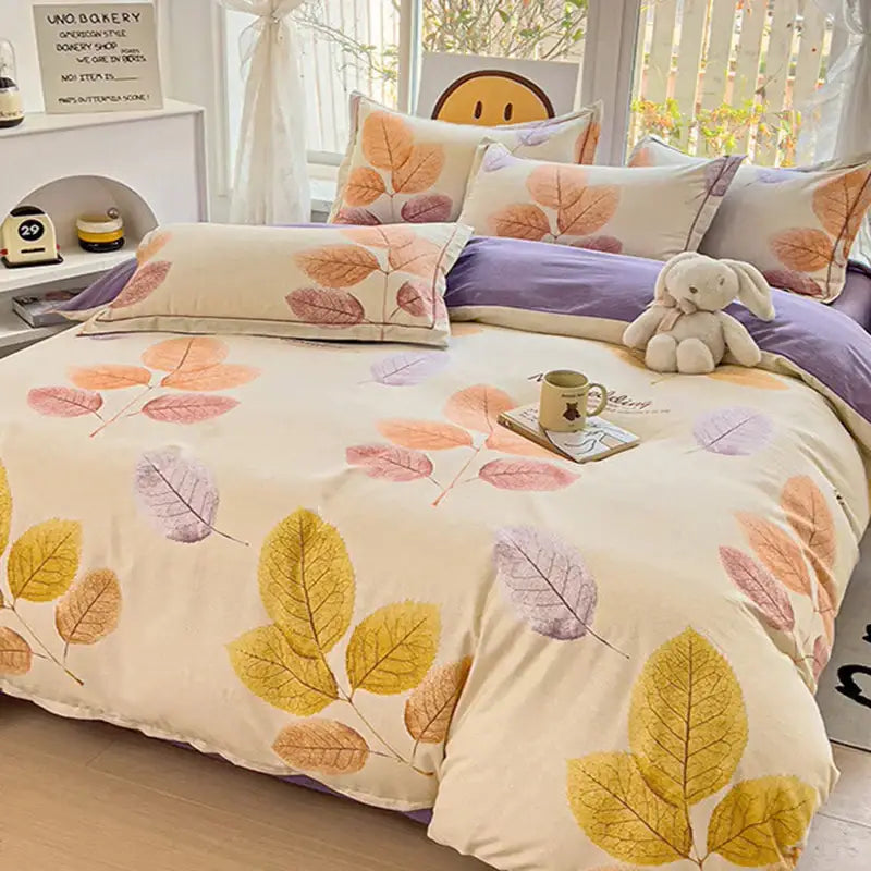 A cozy cream-colored brushed cotton duvet cover set with a soft autumnal leaf pattern in yellow orange and purple