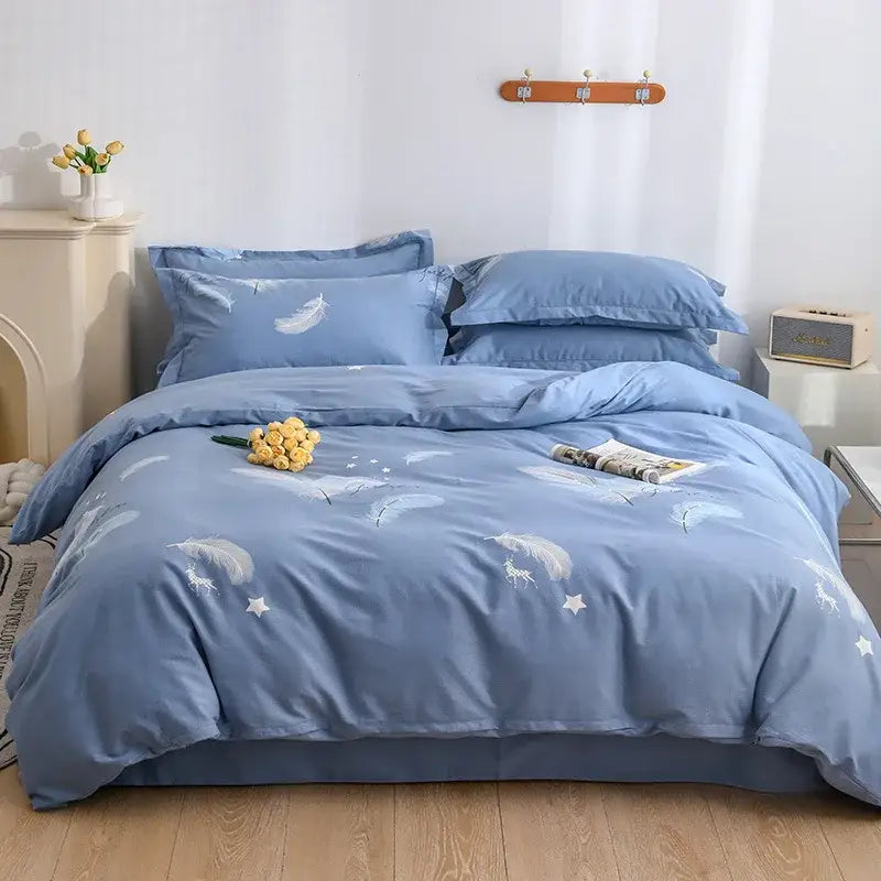 Light blue feather and star-patterned cotton duvet cover set in cream brushed cotton for autumnal bedroom décor