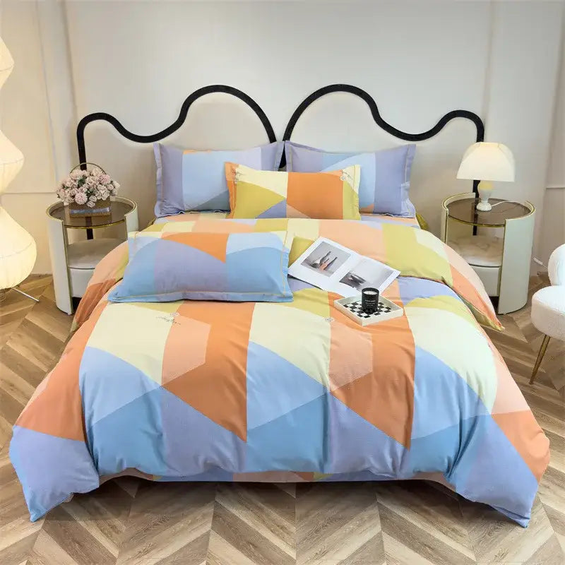 Pastel geometric duvet cover set in soft blue orange and cream tones with a modern patchwork design for bedroom use