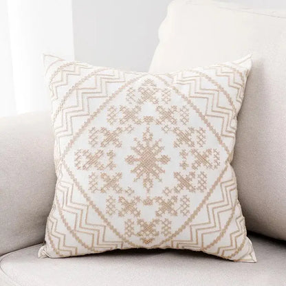 Cream-colored aztec embroidery canvas cushion cover with intricate beige embroidered geometric patterns for living room use