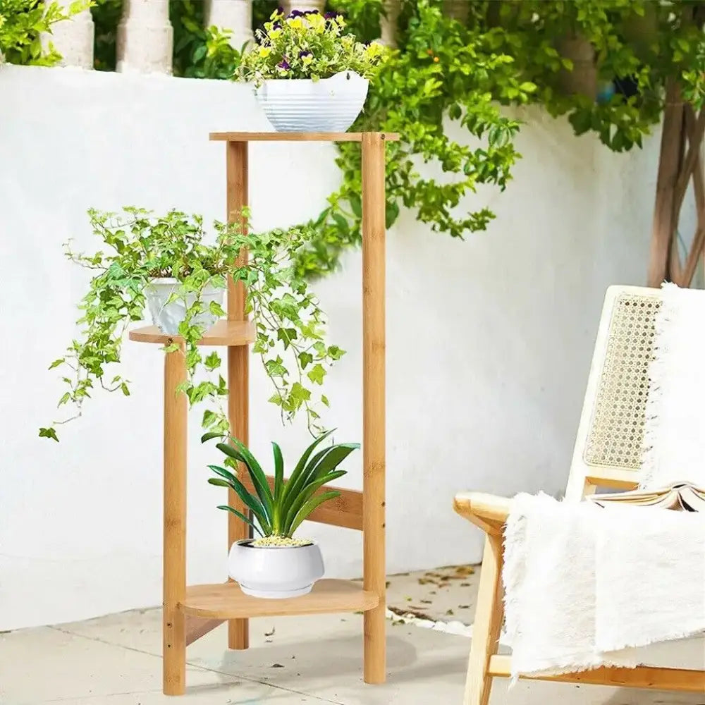 Light brown bamboo decorbites™ 3 tier corner plant stand with shelves for displaying plants and decor items