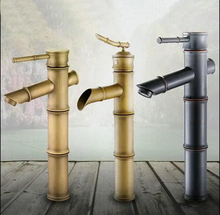 Three bamboo-style basin mixer taps in antique brass and matte black finishes with segmented cylindrical bodies