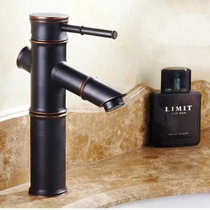 Black bamboo-style high arch mixer faucet with bronze accents for bathroom waterfall use