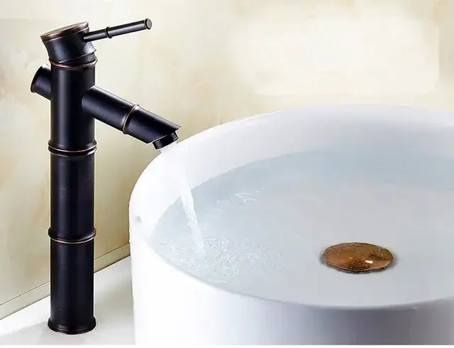 Black bamboo-style high arch mixer bathroom waterfall faucet with bronze accents and copper details
