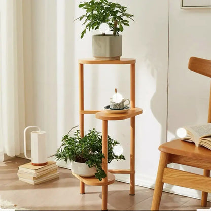 Light-colored bamboo corner plant stand with three circular shelves for flower display by DecorBites™